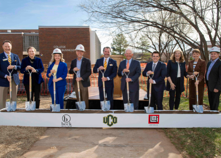 People holding shovels during groundbreaking ceremony