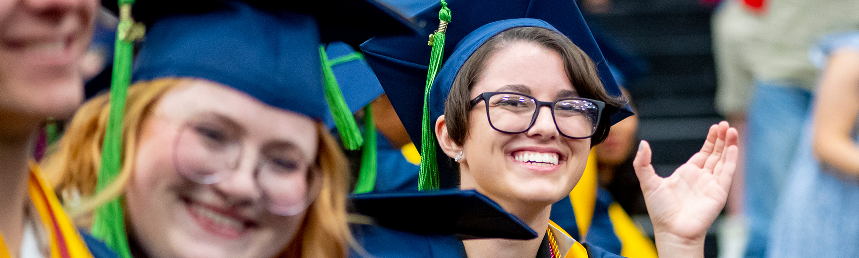 Photo of smiling UCO graduates