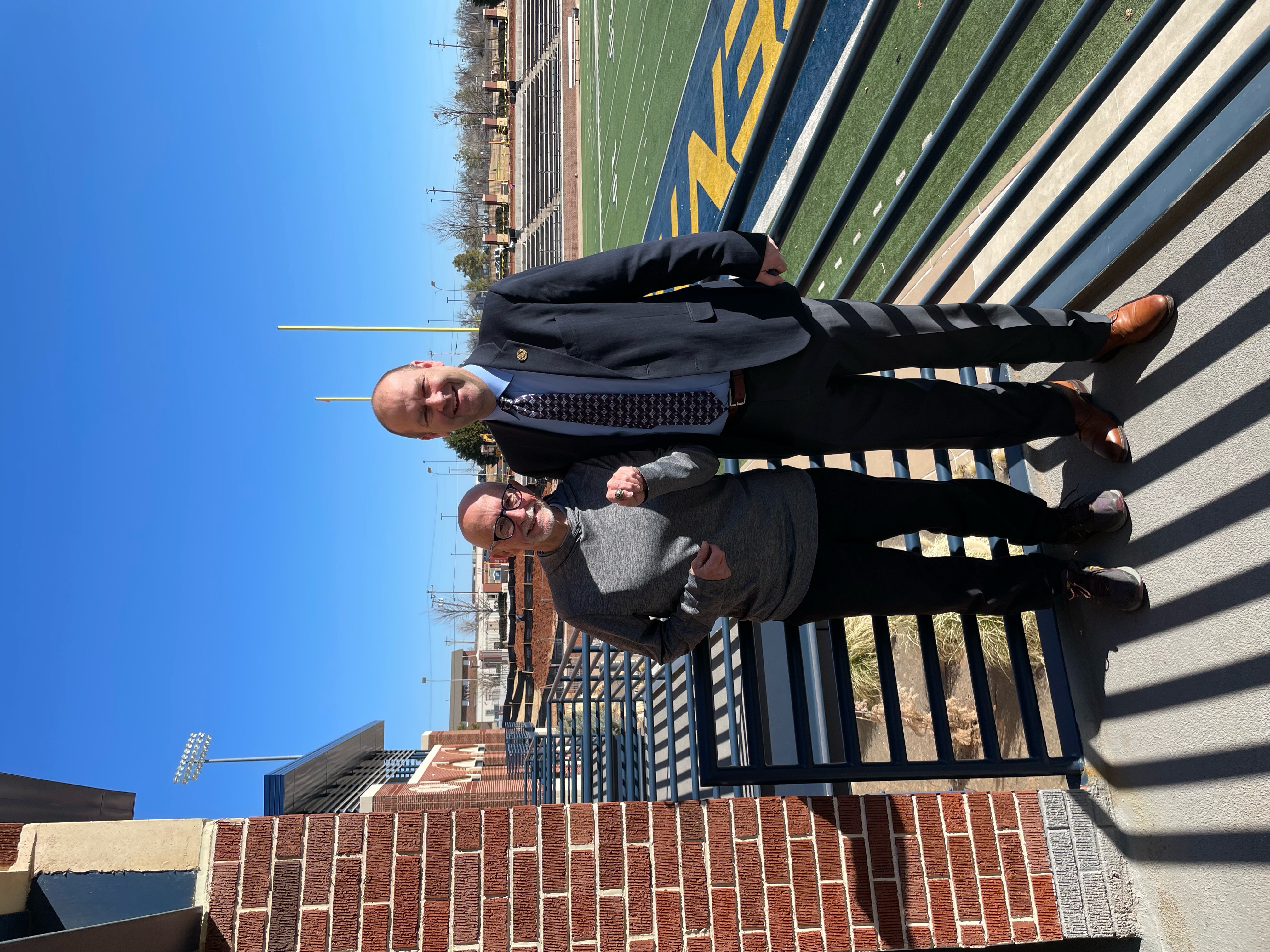 Alum Howard Caplinger standing with Stan Wagnon