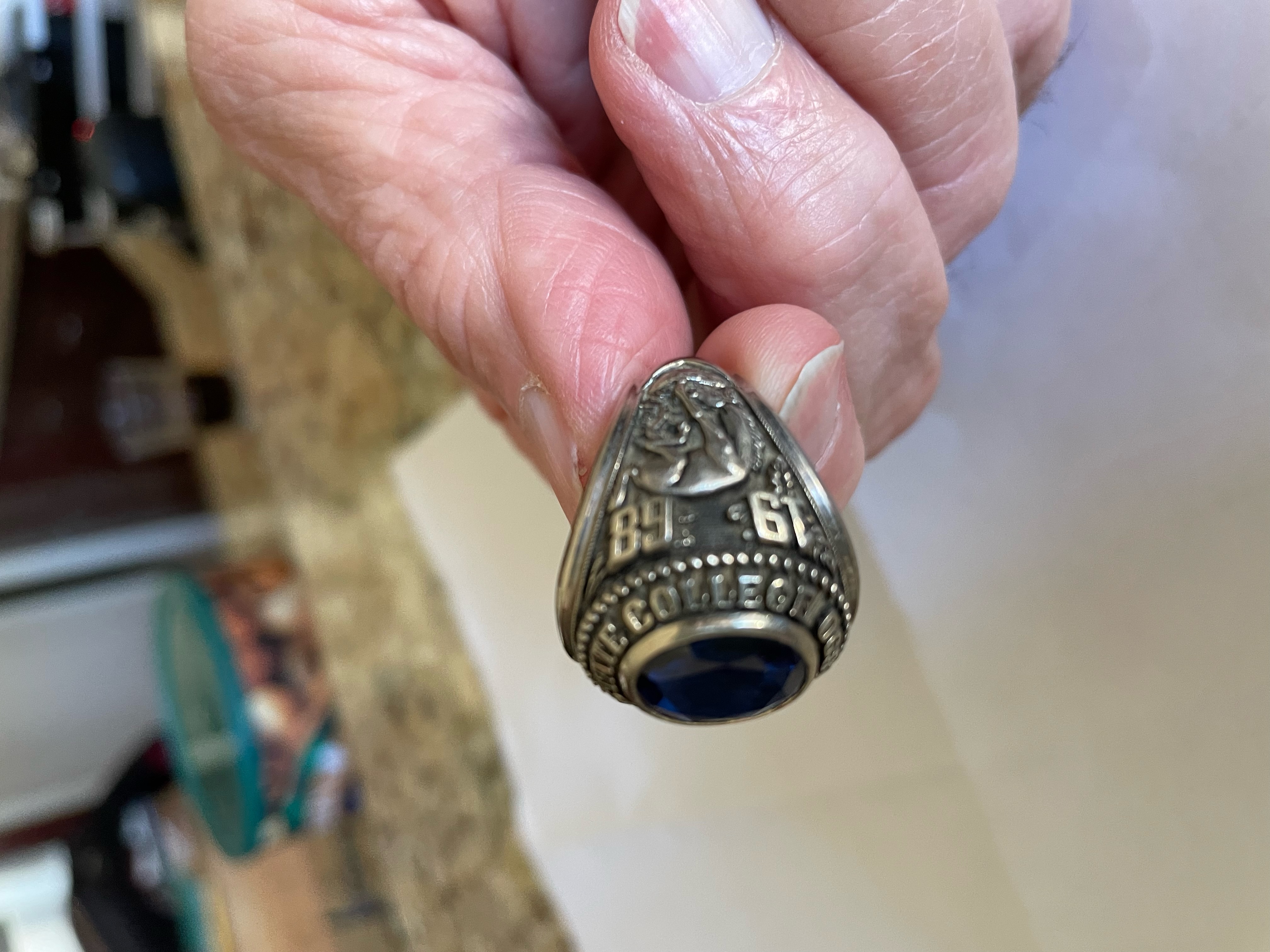 Alumnus holding class ring