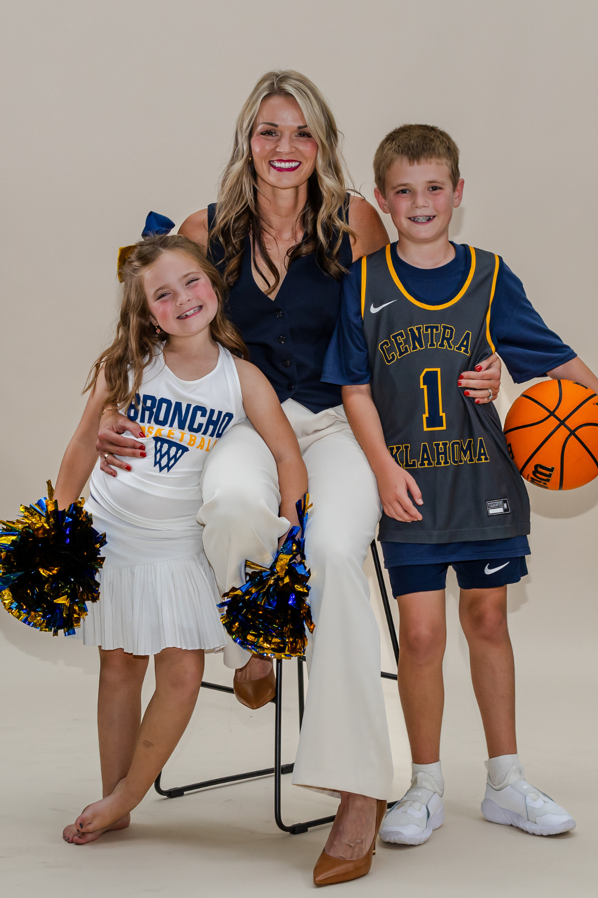 Image of women's basketball coach with children