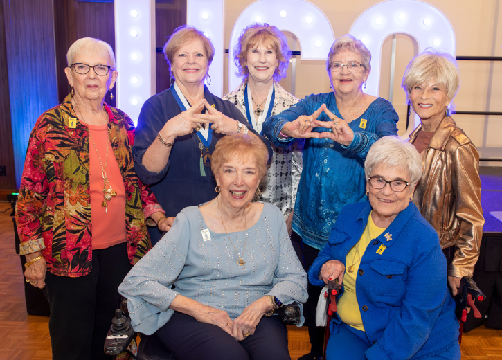 Photo of Golden Bronchos gathered at event