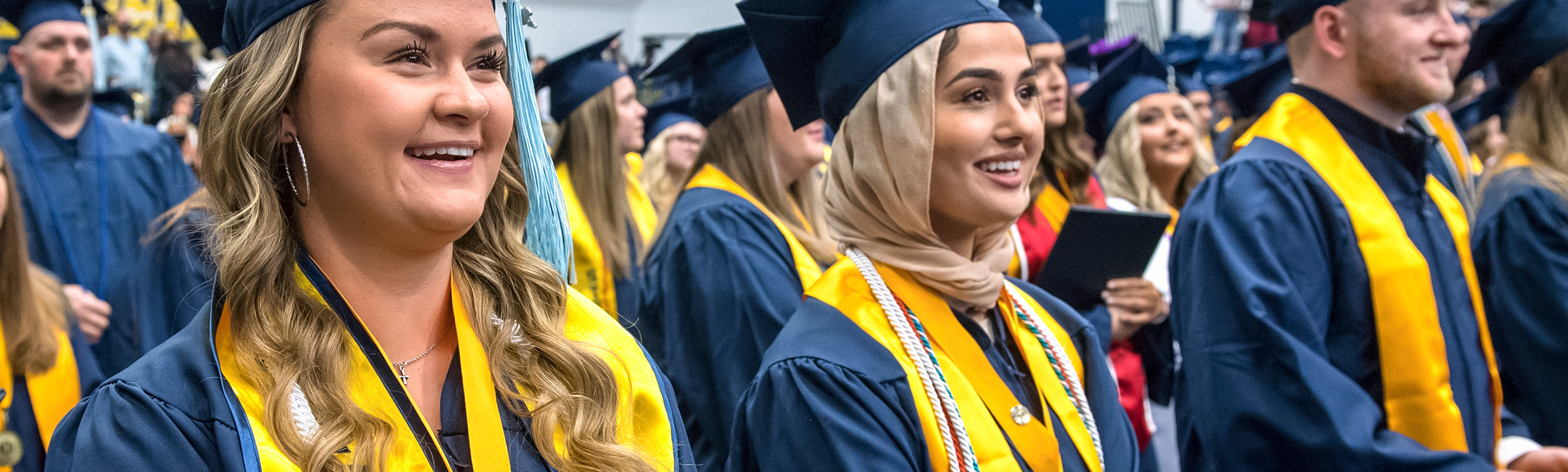 Photo of smiling UCO graduates